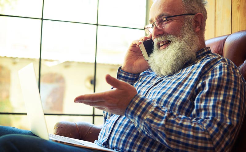 Mature man speaking on phone